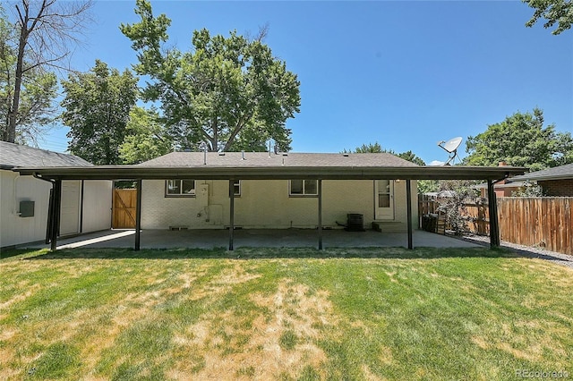 back of house with a patio area, cooling unit, and a lawn