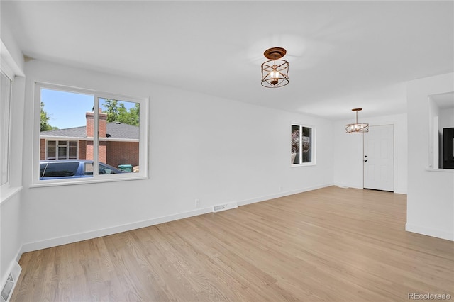 unfurnished room featuring light wood-type flooring