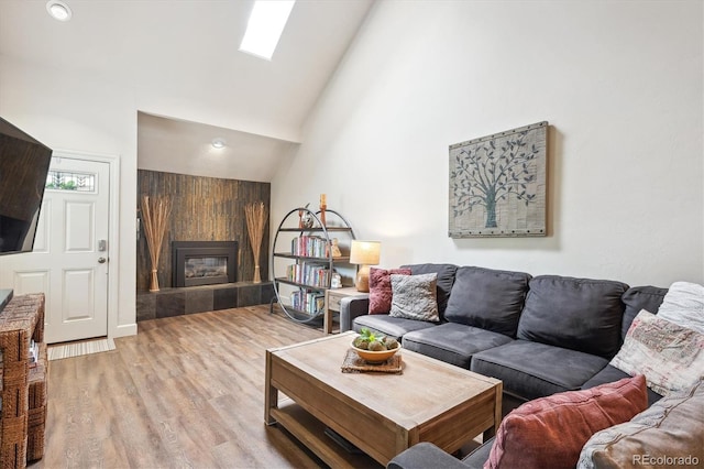 8170 E Phillips Cir, Centennial, CO 80112 - living area with light wood-type flooring, a fireplace, and high vaulted ceiling