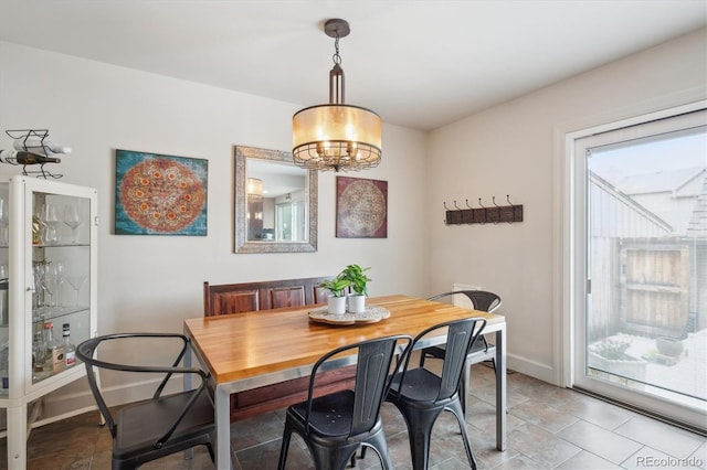 8170 E Phillips Cir, Centennial, CO 80112 - dining room featuring a chandelier and baseboards