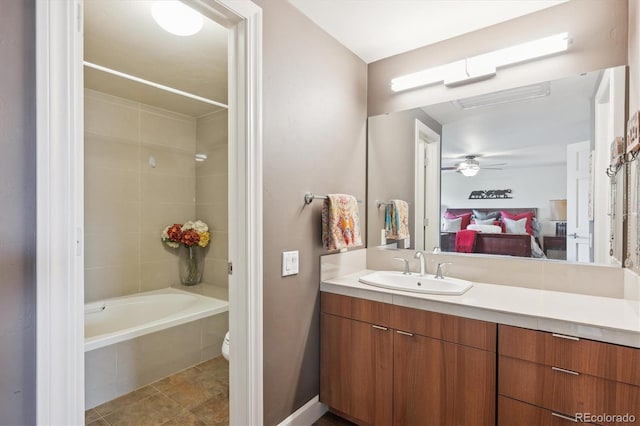 8170 E Phillips Cir, Centennial, CO 80112 - ensuite bathroom with vanity, tiled shower / bath combo, toilet, and ceiling fan