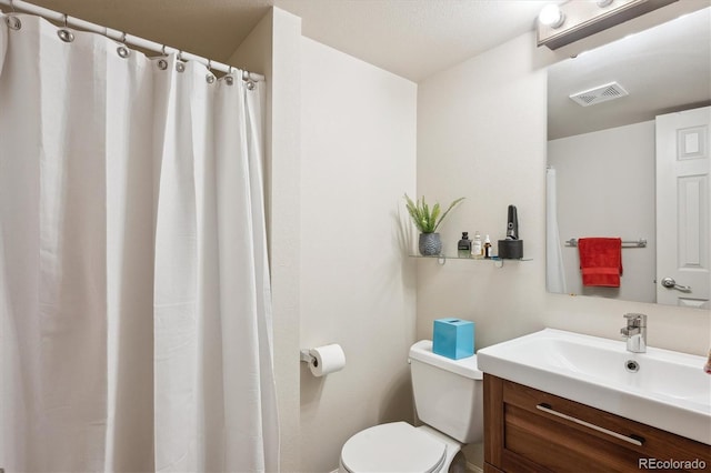 8170 E Phillips Cir, Centennial, CO 80112 - bathroom featuring vanity, toilet, and curtained shower