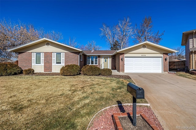 single story home featuring a front yard, brick siding, driveway, and an attached garage