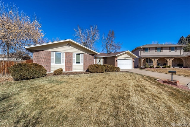 view of front of house with concrete driveway, brick siding, an attached garage, and fence