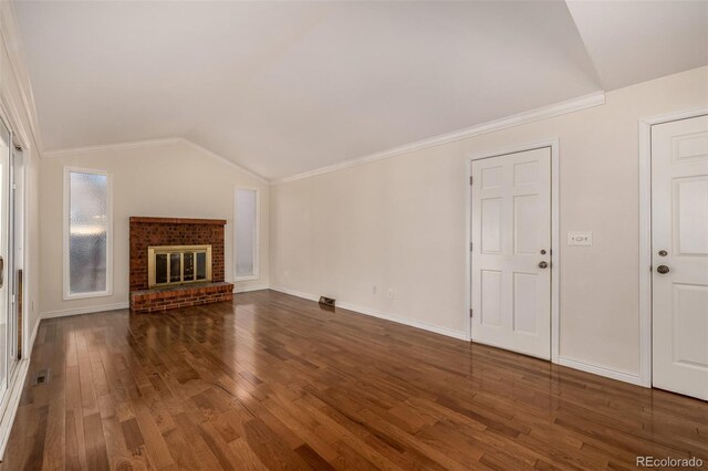 unfurnished living room with visible vents, baseboards, lofted ceiling, hardwood / wood-style floors, and a fireplace