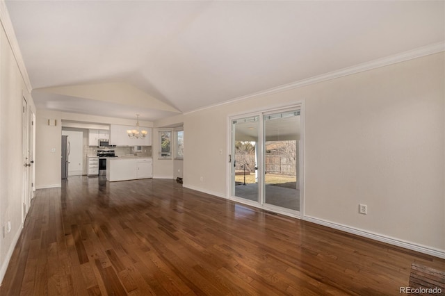 unfurnished living room with lofted ceiling, dark wood-type flooring, baseboards, and an inviting chandelier