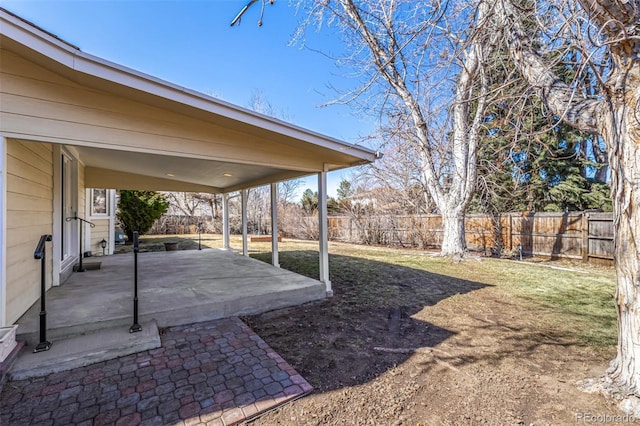 view of yard featuring a fenced backyard and a patio