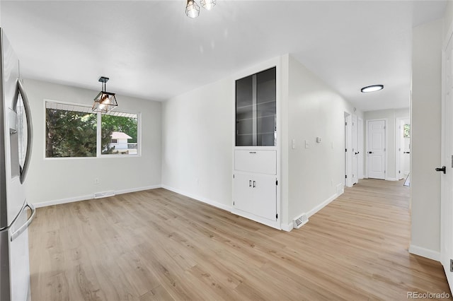 2503-2507 N Taft Ave, Loveland, CO 80538 - unfurnished room featuring light wood-style floors and baseboards