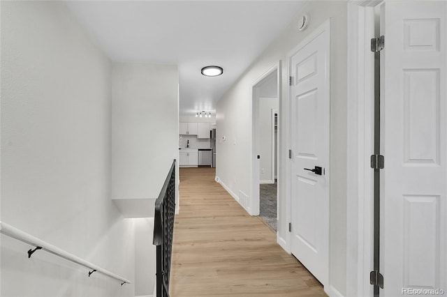 2503-2507 N Taft Ave, Loveland, CO 80538 - corridor with light wood finished floors and baseboards
