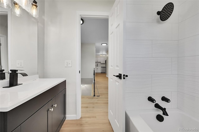 2503-2507 N Taft Ave, Loveland, CO 80538 - full bath featuring vanity, wood finished floors, and shower / tub combination