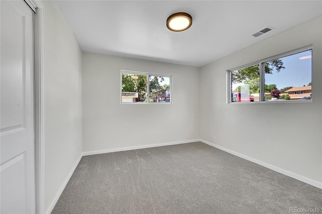 2503-2507 N Taft Ave, Loveland, CO 80538 - empty room featuring carpet floors and healthy amount of natural light