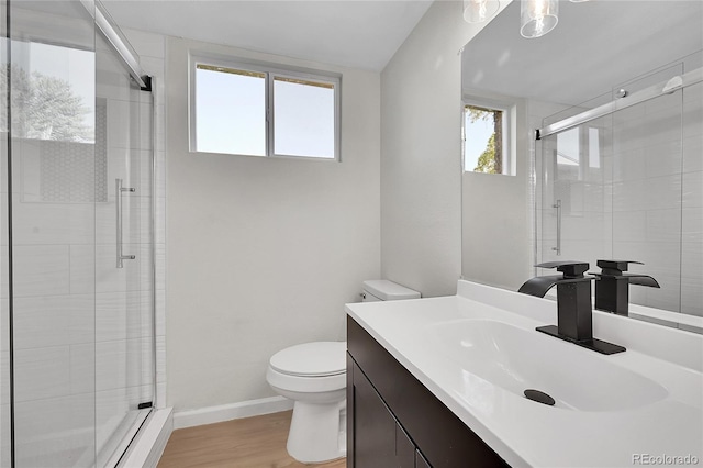 2503-2507 N Taft Ave, Loveland, CO 80538 - bathroom featuring a shower stall, vanity, and wood finished floors