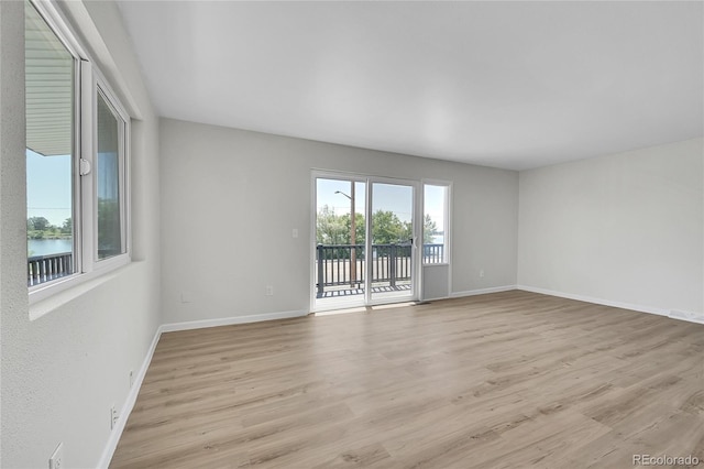 2503-2507 N Taft Ave, Loveland, CO 80538 - unfurnished room featuring light wood-type flooring and a water view