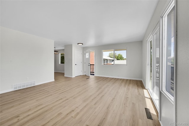 2503-2507 N Taft Ave, Loveland, CO 80538 - unfurnished living room featuring light wood finished floors and healthy amount of natural light