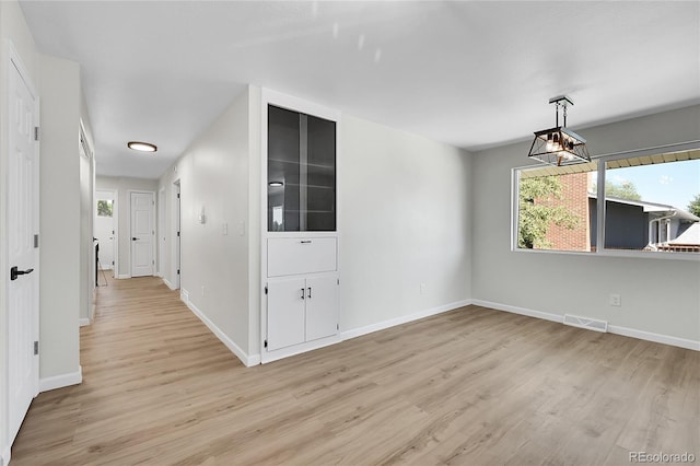 2503-2507 N Taft Ave, Loveland, CO 80538 - unfurnished dining area featuring light wood-style flooring and baseboards
