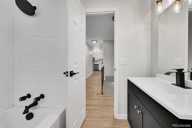 2503-2507 N Taft Ave, Loveland, CO 80538 - bathroom featuring vanity, wood finished floors, and shower / tub combination