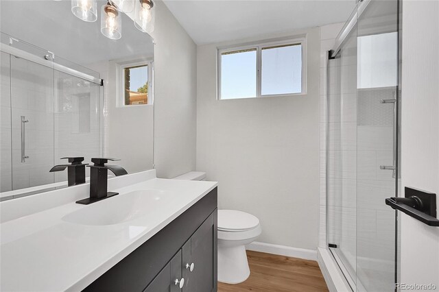 2503-2507 N Taft Ave, Loveland, CO 80538 - full bath with vanity, a shower stall, wood finished floors, and a chandelier