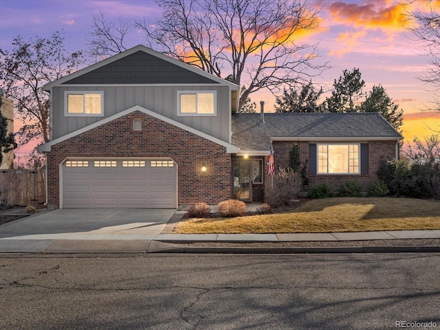 view of front of home featuring concrete driveway, brick siding, board and batten siding, and an attached garage