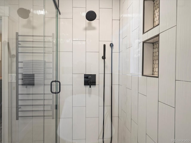 interior details featuring a stall shower