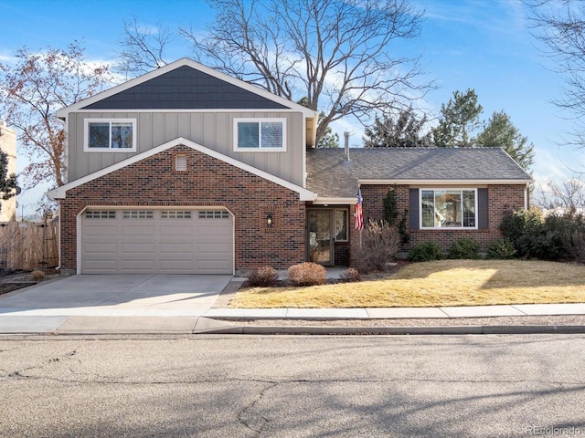 view of front facade with board and batten siding, a front yard, concrete driveway, and brick siding