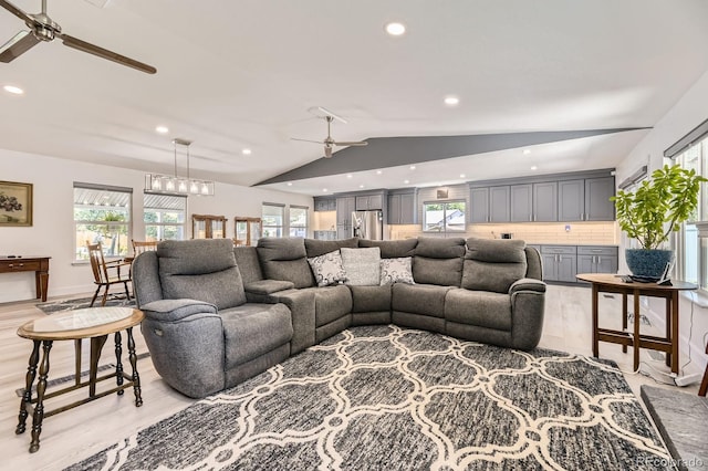 4054 S Olathe Ct, Aurora, CO 80013 - living area featuring a ceiling fan, lofted ceiling, recessed lighting, light wood-style floors, and healthy amount of natural light