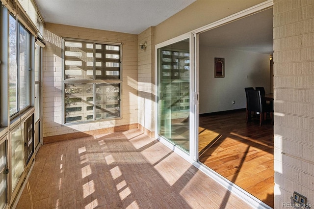 unfurnished sunroom with a healthy amount of sunlight