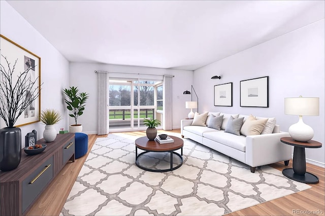 living area with baseboards and light wood finished floors