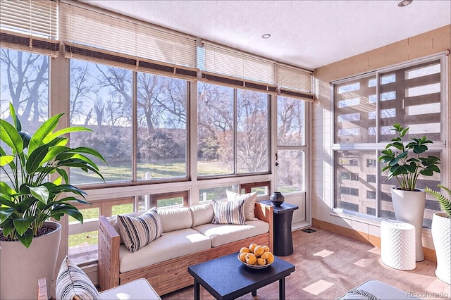 sunroom with an outdoor living space