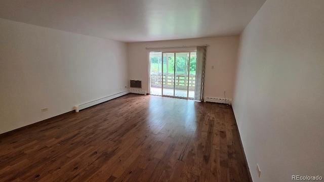 655 S Alton Way Unit 6A, Denver, CO 80247 - spare room with a baseboard radiator and dark wood finished floors