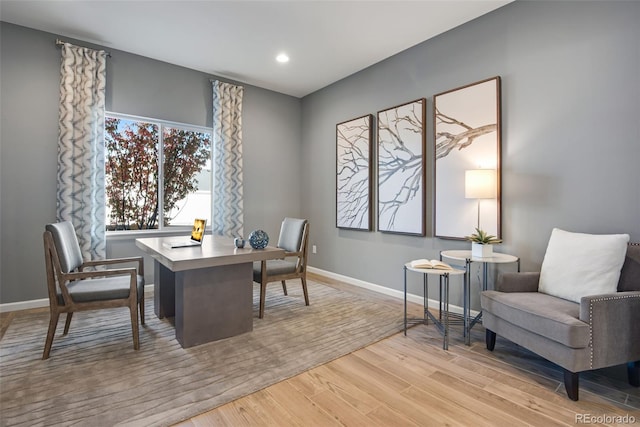 office space with light hardwood / wood-style flooring