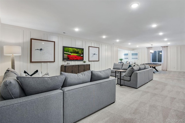 living room featuring light colored carpet and billiards