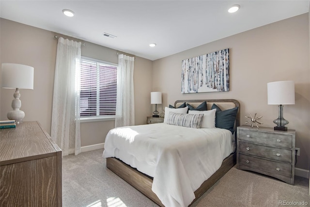 bedroom with light colored carpet