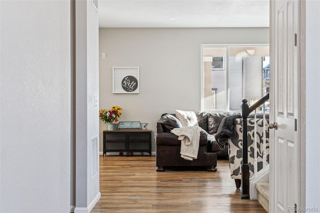 living area with wood-type flooring