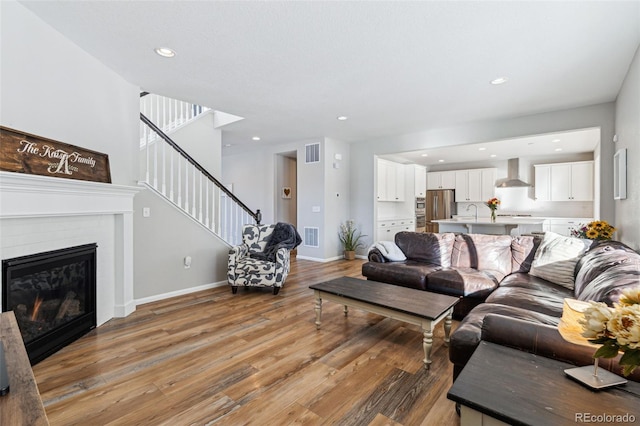 living room with light hardwood / wood-style floors