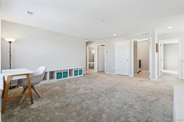 living area featuring light colored carpet