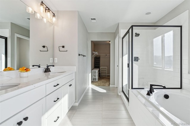 bathroom featuring vanity, tile patterned floors, and independent shower and bath