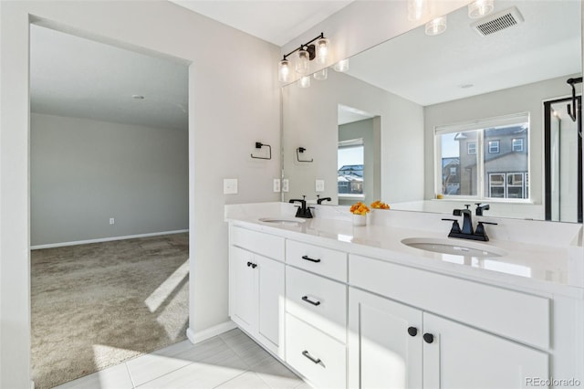 bathroom with tile patterned floors and vanity