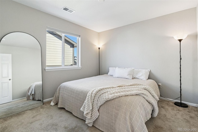 bedroom with light carpet