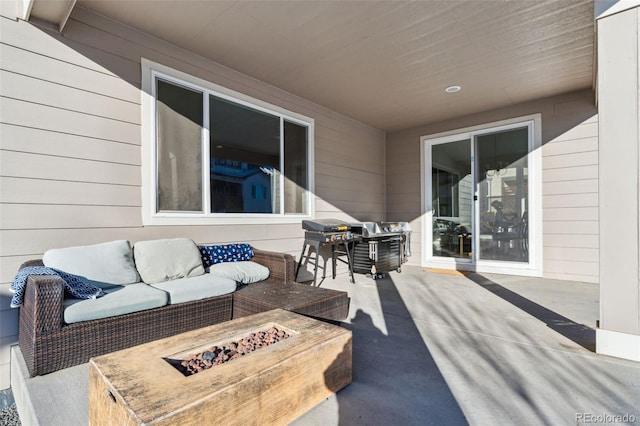 view of patio / terrace featuring an outdoor living space with a fire pit