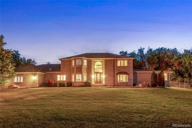 traditional-style home with a yard