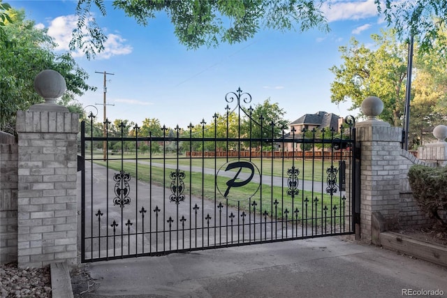 view of gate featuring fence