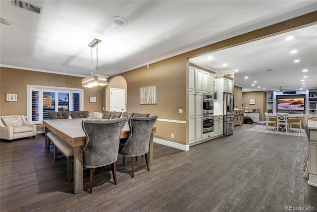 dining area featuring ornamental molding, dark wood-style flooring, recessed lighting, and visible vents
