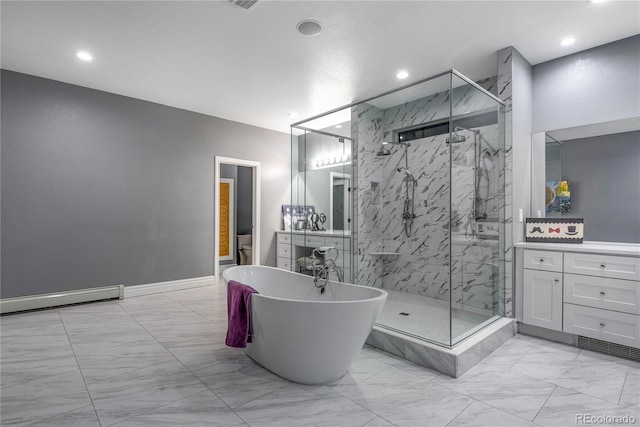 bathroom featuring a freestanding bath, a marble finish shower, marble finish floor, recessed lighting, and a baseboard radiator
