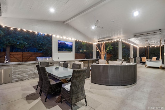 view of patio / terrace featuring grilling area, exterior kitchen, ceiling fan, and outdoor dining area