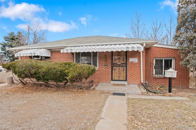 view of front of home with brick siding