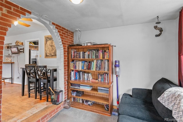 sitting room featuring arched walkways