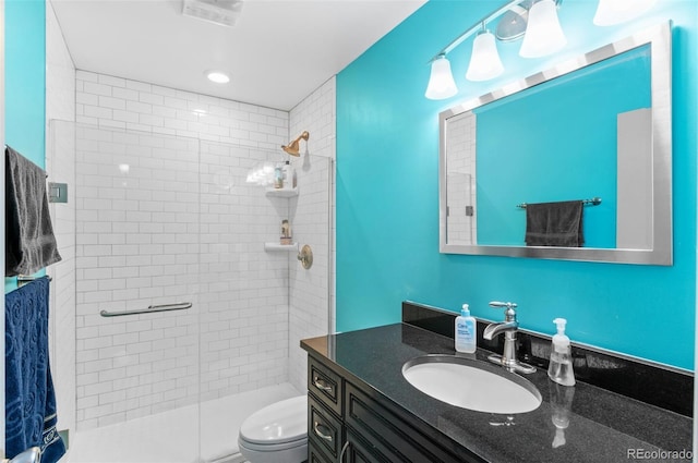 full bathroom with visible vents, a stall shower, toilet, and vanity