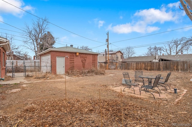 view of yard featuring an outdoor structure and a fenced backyard