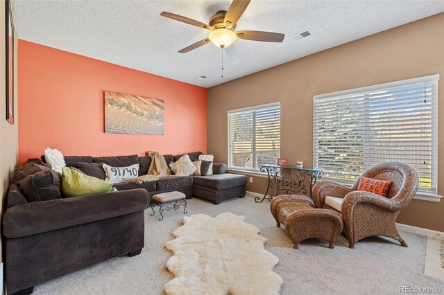 20466 Willowbend Ln, Parker, CO 80138 - living room featuring visible vents, a ceiling fan, baseboards, and carpet floors
