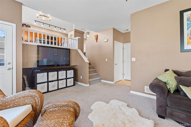 20466 Willowbend Ln, Parker, CO 80138 - carpeted living area with stairway, baseboards, and a textured ceiling